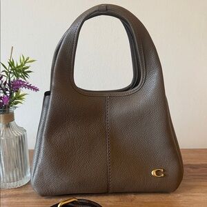 Coach Lana 23
Brass/stone